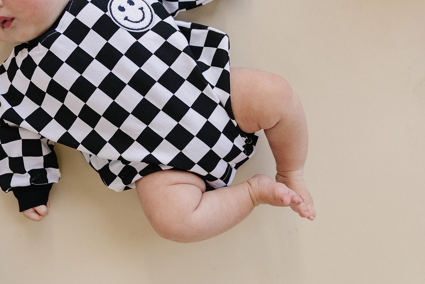 Bubble Romper | Checkered Smiley Black